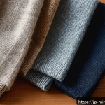 미니멀 럭셔리 제품의 신뢰성 평가 - A close-up image of luxurious minimalistic clothing materials displayed on a wooden table, featuring...
